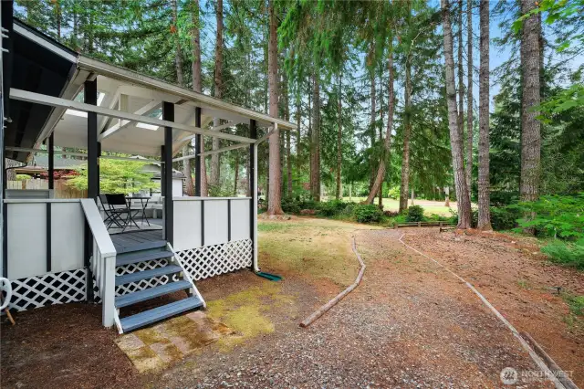 Back of the home - steps down to the path to the course