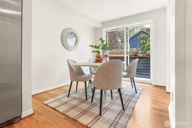 The breakfast nook is on the east end of the kitchen, next to the sliding door to a rear deck.