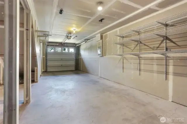 The garage could fit two smaller vehicles (tandem), and has plenty of room for gear storage.