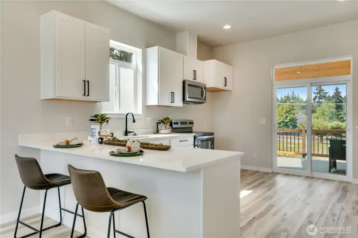 Sliding glass doors lead to your private balcony perfect for BBQ and a beverage as the day ends.