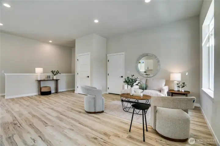 Downstairs you'll find two additional bedrooms, a full bath and laundry areas