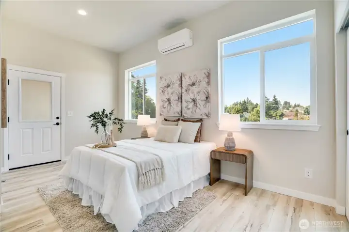 Generous owners suite on the main floor!  Private door leads to the balcony.  You'll get double closets and your own private bathroom.