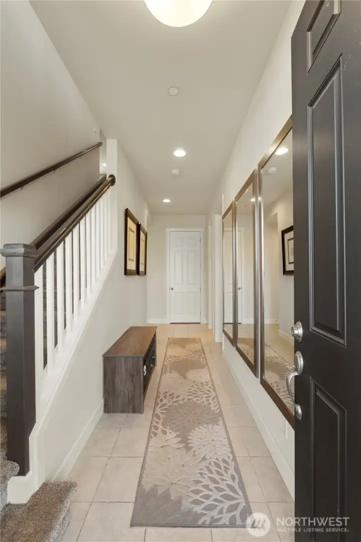 Big entry leading to lower level bedroom & bath suite.