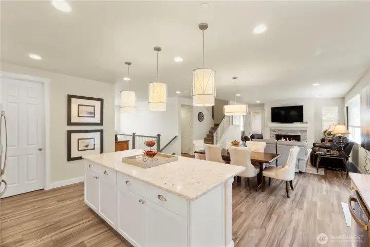 Kitchen flows to the dining room,  living room and great room.