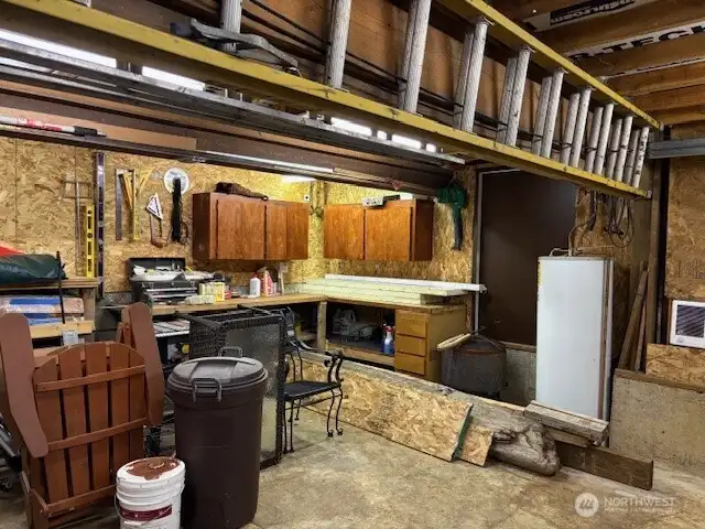 Attached garage/shop/storage space. Great for storing outdoor furniture during the winter season.