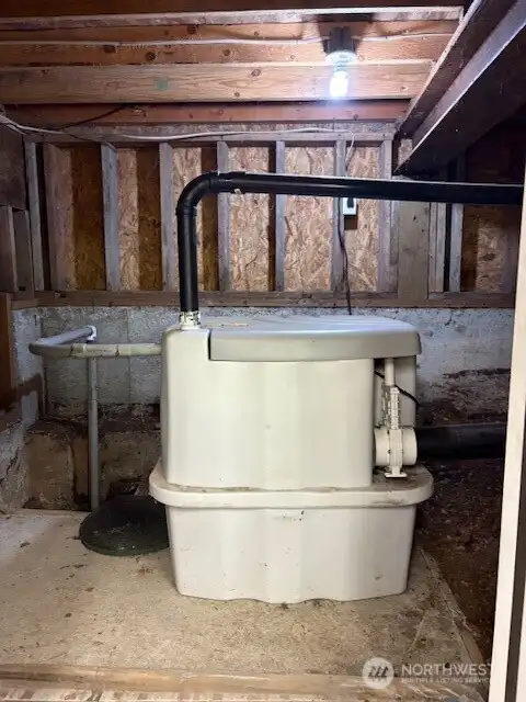 Cabin is on the USDA Forest Service sewer system with private holding tank and grinder pump. This unit is stored in a private storage area off of garage area.