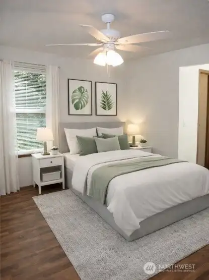 Virtually staged primary suite with new ceiling fan, walk-in closet and bath to the right.