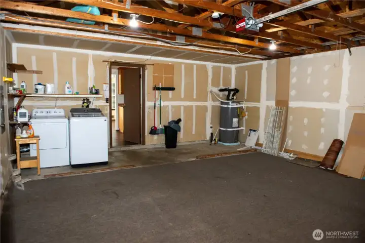 Two car garage with newer washer & dryer, all appliances to stay with home.