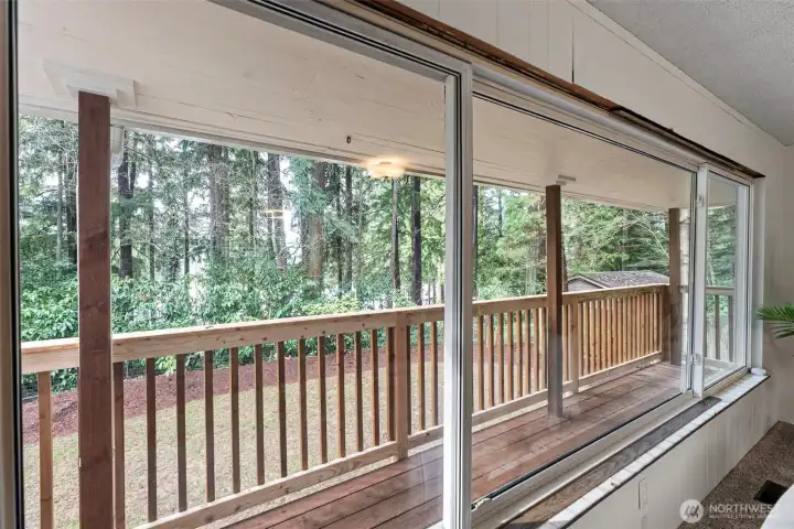 Through living room window to back deck