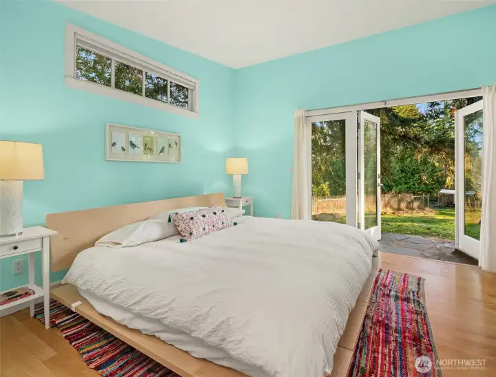 The private primary suite is opposite the bedroom wing of the home for peace and quiet. Lovely french door access to the eastern side of the home. Built in cabinetry plus a walk-in closet. Bring all your favorite wardrobe items!