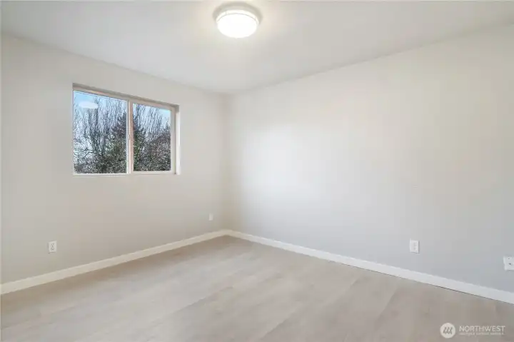 Bedroom 1 with views of front street