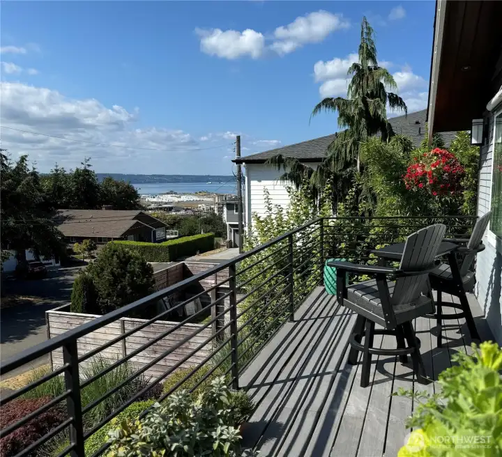 The front balcony over the driveway is all you need on a warm summer even to take in a sunset and just a little activity below. One is just far back enough off the street