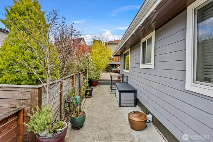 Up off the street is the main entry and access to the back deck. Guests can arrive without entering the home Up off the street is the main entry and access to the back deck. Guests can arrive without entering the home