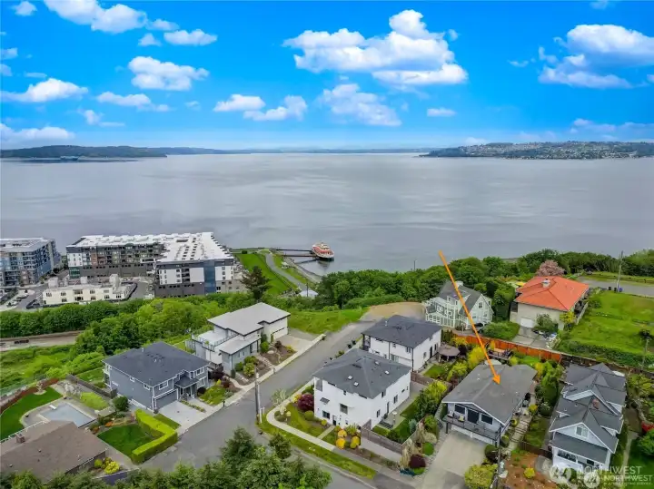Aerial views looking out showing neighboring homes and Pt. Ruston below Aerial views looking out showing neighboring homes and Pt. Ruston below