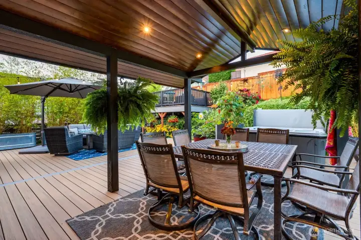 The recently updated back patio with composite decking and illuminated covering making it a great spot to gather and hot tub The recently updated back patio with composite decking and illuminated covering making it a great spot to gather and hot tub