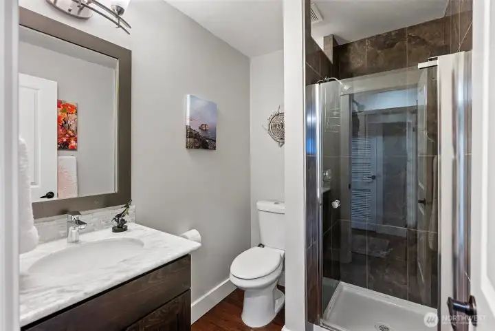 Lower level 3/4 bath is shared by the two lower level bedrooms. Recently updated Lower level 3/4 bath is shared by the two lower level bedrooms. Recently updated