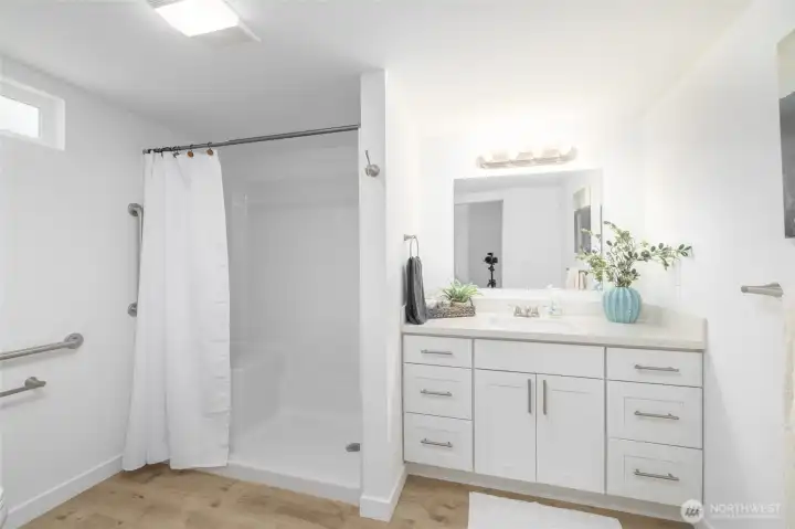 Primary bath with walk-in shower stall and bench seating