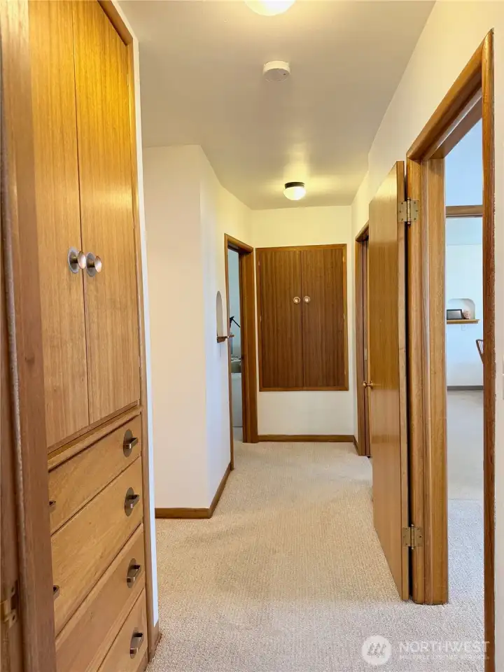 Hallway with access to multiple rooms