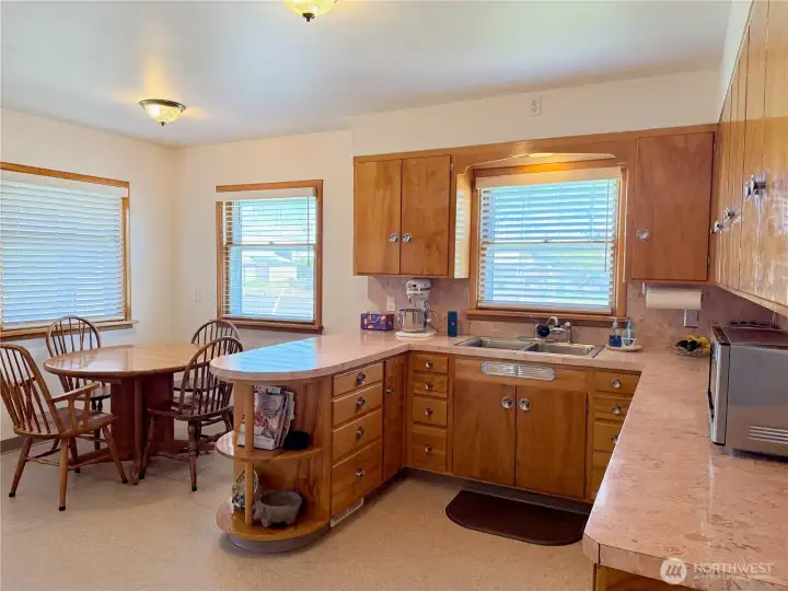 Kitchen with ample cabinet space and dining area