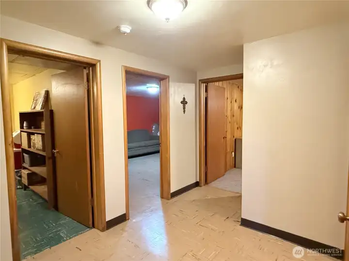 Lower-level hallway with storage and access points