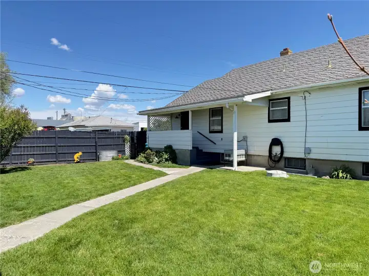 Expansive backyard with lush lawn
