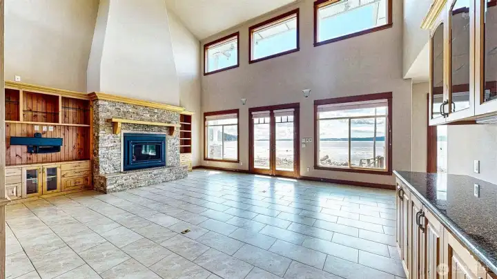 Huge great room with gas fireplace and built in cabinets.
