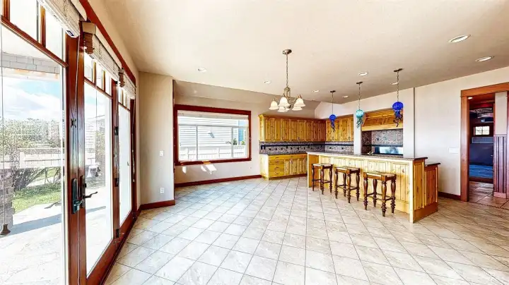 Continuing to the right is a dining area that can have a huge dining table chairs and bench.