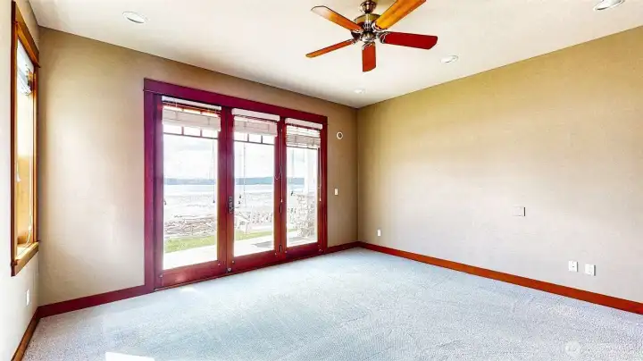 French doors from the primary suite to the covered patio with aporch swing. And.....