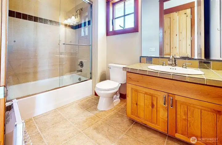There are three full size bathrooms on the upper level. Two of which are private on suites and one other hall full bath for the bonus room and den.