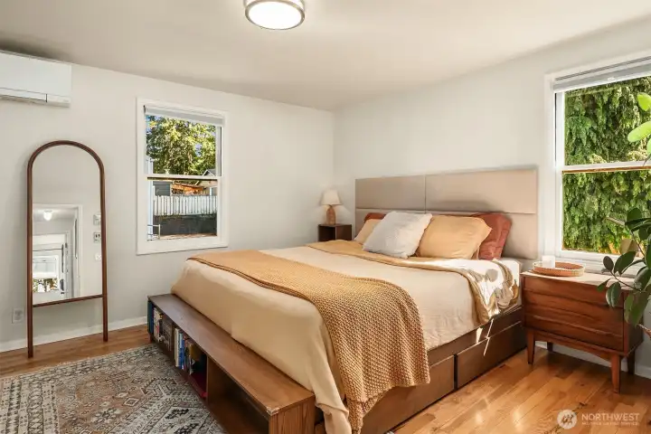 Spacious main bedroom on upper level, overlooking the lovely, peaceful backyard