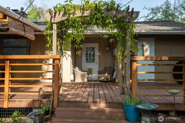 Seating area on back deck right in front of secondary laundry room.