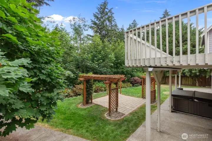 Enjoy summer evenings with a hot tub, fire pit, and beautiful greenbelt views.