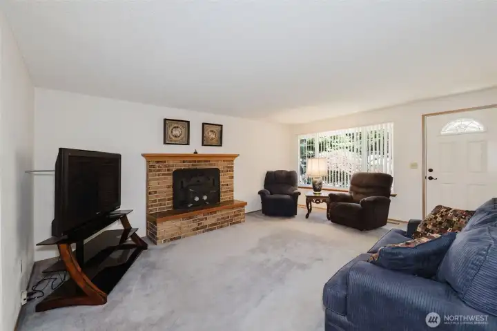 Living room with wood fireplace Living room with wood fireplace