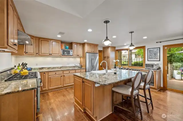 Beautifully Updated Chefs Kitchen with Quartz Countertops, Farmhouse Sink & High End Appliances