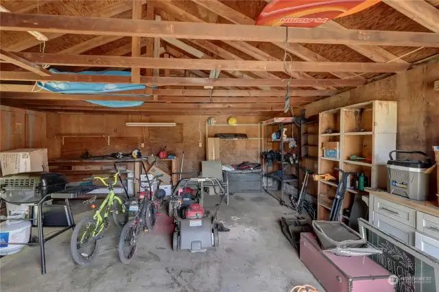 Inside garage ... yup, used for storage too. Man door (not visible) is at left.