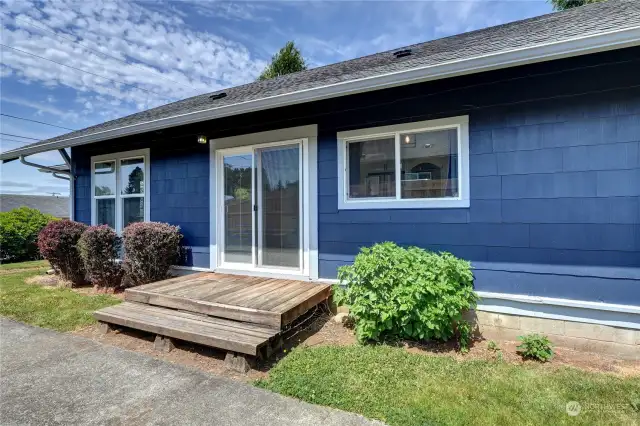 Sliding doors are between kitchen and dining room