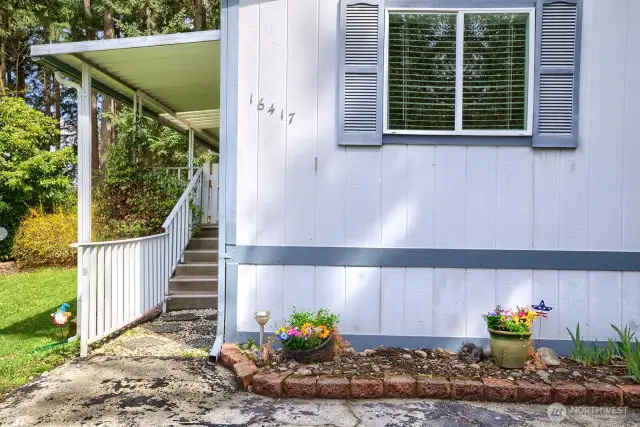Home is bordered by plants, shrubs and year-round greenery for your enjoyment.