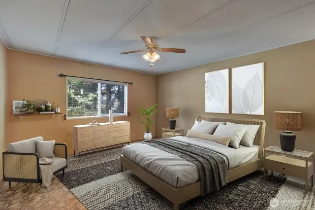 Primary suite at north end of the home is HUGE! Room for king size bed and additonal furniture. Ceiling fan for your comfort.