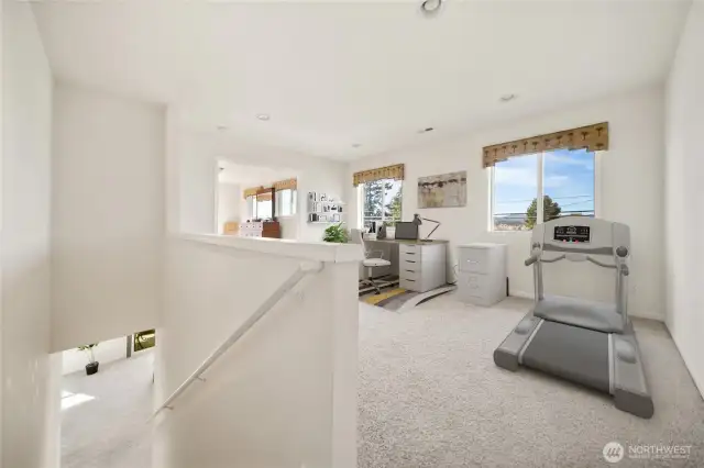 Primary bedroom sitting area with multiple uses