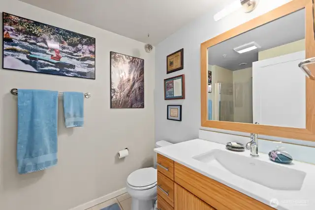 Guest Full Bath located off the Hallway from the Kitchen.