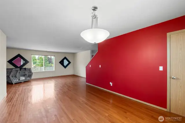 This view highlights the impressive scale of the combined living and dining area, offering ample space for both everyday living and entertaining.