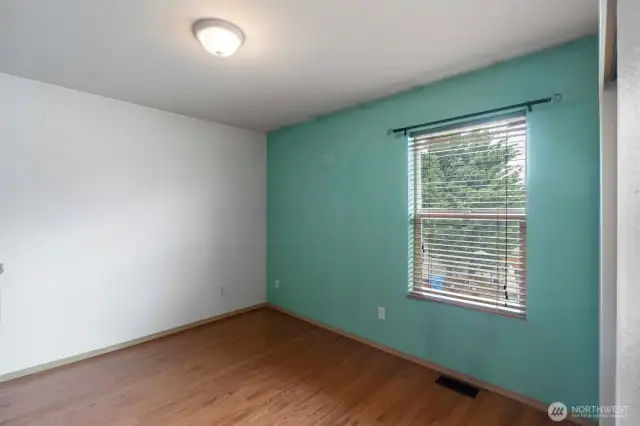 One of three spacious guest bedrooms on upper level.