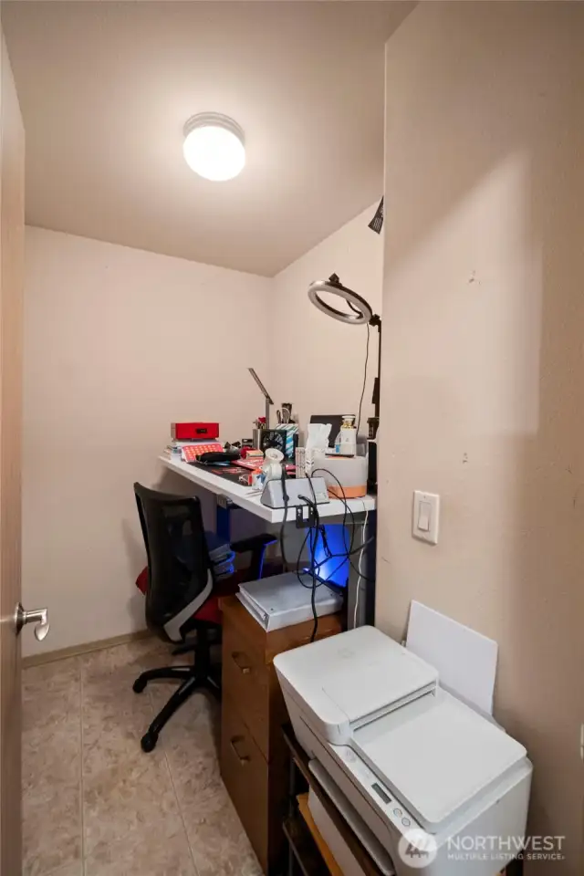 An additional room on the upper level offers versatile use—ideal for a home office, hobby room, or extra storage space.
