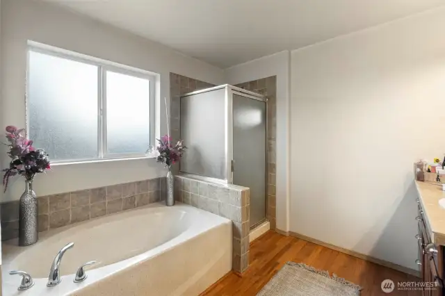 Unwind in the deep soaking tub, ready for bubbles, with newly refreshed coatings on the tub and shower for a clean, updated look.