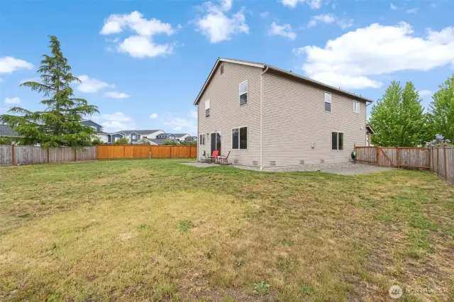 The spacious backyard is fully fenced, providing a blank canvas ready for your vision and outdoor plans.