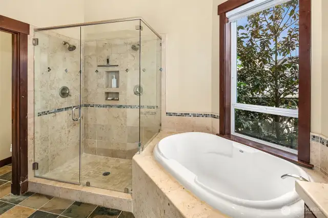 Multi-headed walk in shower and deep soaking tub.
