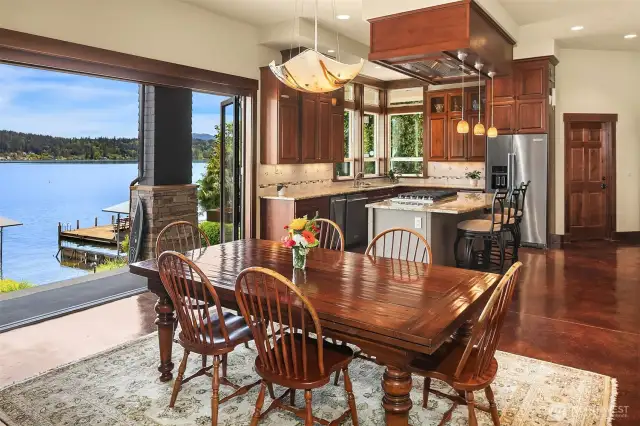 A panorama of glass doors for the ultimate in al fresco living!  The party is always in the kitchen and this one is sure to please the most discerning chef.