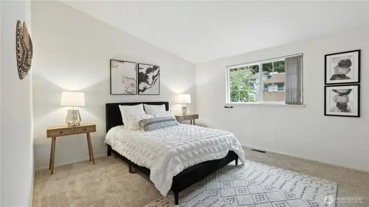 The primary bedroom combines a sleek design with natural light and spaciousness, perfect for adding seating areas beyond the bed