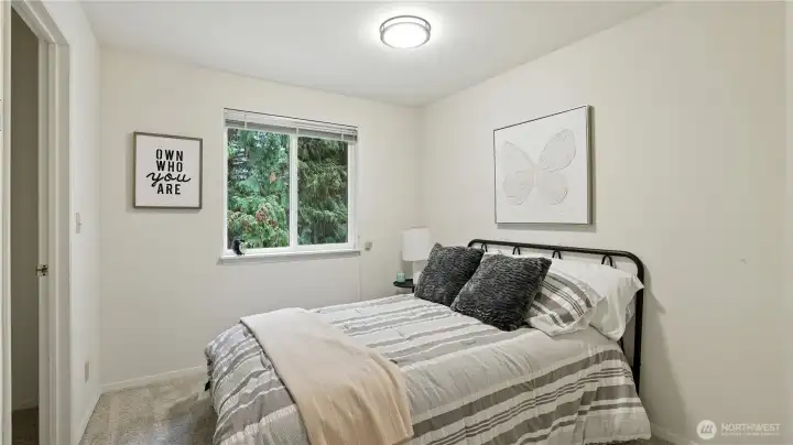 Featuring brand new carpets, new lighting, a walk-in closet and attic access, this roomy guest bedroom offers plenty of storage and comfort for your visitors