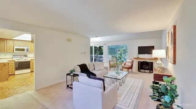 This living room is filled with natural light thanks to the glass sliding door to the backyard, creating a seamless indoor-outdoor flow